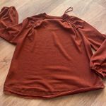 Brand New In Burnt Orange Top. Size medium. Photo 2
