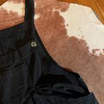 Boutique Black  wide leg jumpsuit  size XL zipper on side Does not fit a XL here are the actual measurements - Pit to pit - 18 inches  Inseam - 29 inches  Photo 3