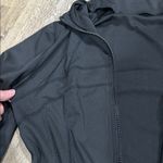 Women's Black running jacket with thumb holes. Photo 2