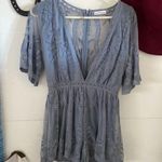 Dainty Hooligan  Periwinkle Blue Plunging Neckline Lace Romper Photo 0