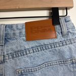 Princess Polly  Asymmetrical Denim Shorts Light Wash Cutoff Raw Hem Size 6 Photo 4