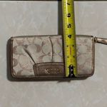 Coach  signature Charlie C zip around wallet gold with purple interior Photo 8