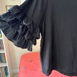 H&M black ruffled sleeve top Photo 1