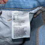 American Eagle AE Distressed Next Level Stretch Curvy Hi Rise Shortie Shorts Photo 5