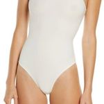 SKIMS  Fits Everybody High Neck Thong Bodysuit in Marble Cream Photo 0