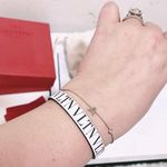 Valentino Garavani Authentic White & Black Thin Leather VLTN Buckle Bracelet Photo 1