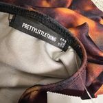 Pretty Little Thing Brown Tortoise Print Cut Out Center Ring Swimsuit Photo 8