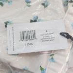 We Wore What Blue Floral Cut Out Denim Mini Skirt NWT Size Large Floral Jean Skirt Photo 8