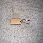 Coach  tan/ yellow cream Keychain Tag Photo 2