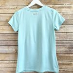 Under Armour Tee Women’s Size XS Blue White Short Sleeve Graphic Photo 1