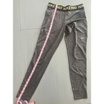 Nike Pro Dri-Fit Gray Womens Leggings size Medium Glitter Swoosh Photo 2