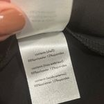 We Wore What NWT  Black Asymmetrical Cutout Dress Short Sleeve Flower Pin Size L Photo 6