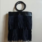 Anthropologie Black Fringe Bag with circle wood handles Photo 1