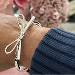 Kate Spade  Silver Bow Bangle NWT Photo 0