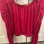 Free People Movement FP Dakota Long sleeve in the color Pomegranate (Reddish/magenta)  top with an elastic band around the bottom #freepeople #fpmovement Photo 4