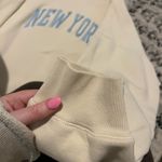 Brandy Melville John Galt “New York” Yellow Crewneck Photo 4
