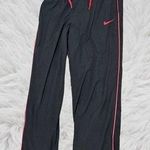 Nike Black and Pink Sweatpants for Sporty Comfort Photo 0