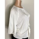 Vince Camuto New. ivory blouse bar top. Retails $89. Size XS. runs a little big. Photo 5