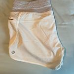 Lululemon  White Athletic Shorts with Elastic Waistband and Pleated Design Photo 1