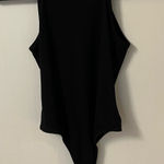 We Wore What  Danielle Bernstein Black Ribbed Tank Bodysuit Photo 0