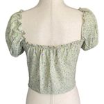 Motel -LIGHT GREEN FLORAL CROP TOP-SIZE MEDIUM Adorable green crop top with little purple flowers, side zipper, puff sleeves, size medium, excellent condition  Measurements: Bust: armpit to armpit 17 inches  Length: shoulder seam to bottom 16 inches Photo 5