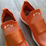 APL  Women’s Sz 8.5 Techloom Bliss Sneakers in Orange Photo 3