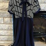 SheIn  pleated skirt puff sleeve dress with bow tie detail size medium navy Photo 0