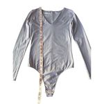 Everlane Supima Cotton Long-Sleeve V-Neck Bodysuit T-Shirt In Dusty Lavender Photo 11