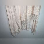 Blush Noir : Asymmetrical Hem Creme Tunic with Delicate Lace details. Photo 2