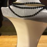 Vintage beautiful necklace with gold black beads and gold chain and a pendant.​ Photo 1