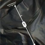 We Wore What  black sheen crossover leggings Photo 4