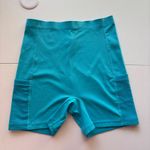 Greyson Women's Turquoise Blue Athletic Biker Shorts With Pockets Photo 0