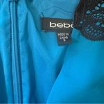 Bebe  women's size small blue with black lace v-neck romper Photo 3