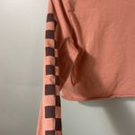 Vans  XS long sleeve crop top logo shirt on peachy tone. Photo 8