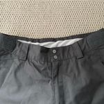 Helly Hansen  medium insulated dark grey snow pants. Adjustable waist and pockets Photo 5