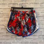 Nike Women’s  Dri-fit Orange blue and white floral print lined athletic shorts M Photo 1