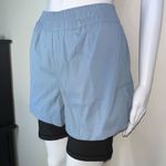 We Wore What  Windbreaker Biker Short in Dusty Blue Photo 8
