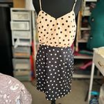 Peppermint Two-tone polka dot dress:
Elegant dress with a strappy design Photo 1
