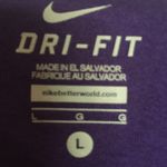 Nike Dri-fit purple shirt with  swoosh on the front size Large Photo 2