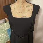 Apostrophe  Essential plus size black dress with open neckline and thick straps. Photo 1