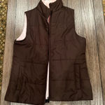 Old Navy Stay warm and stylish with this brown sleeveless puffer vest. Perfect for layering in cooler weather. Photo 0