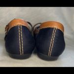 Nine West  Black slip-on shoes with a leather brown trim with a belt. Photo 1