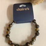 Icing  & Claire’s Gold-Toned Bracelet Cord, Brown Beaded Bracelet, Hair Ties. Photo 1