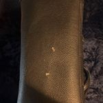 Franco Sarto  black leather bag. Red interior. Used with small minimal tears. Photo 4