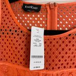 Bebe NWT Orange Lace Paneled Short Sleeve Top Photo 3