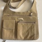 Baggallini LIGHT OLIVE GREEN SHOULDER BAG WITH SNAP FLIP CLOSURE
LOTS OF POCKETS Photo 0