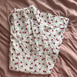 Colsie White Pajama Pants with Red Floral Design Medium Photo 1