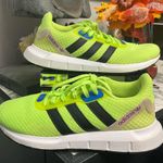Adidas Neon Green Athletic Shoes with Black Stripes Photo 0