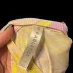 Fabletics  flourescent yellow and purple swirls on a cream tee. NWOT. Photo 4