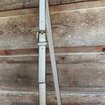 Gray suede Crossbody purse with gold loop and chain details Photo 4